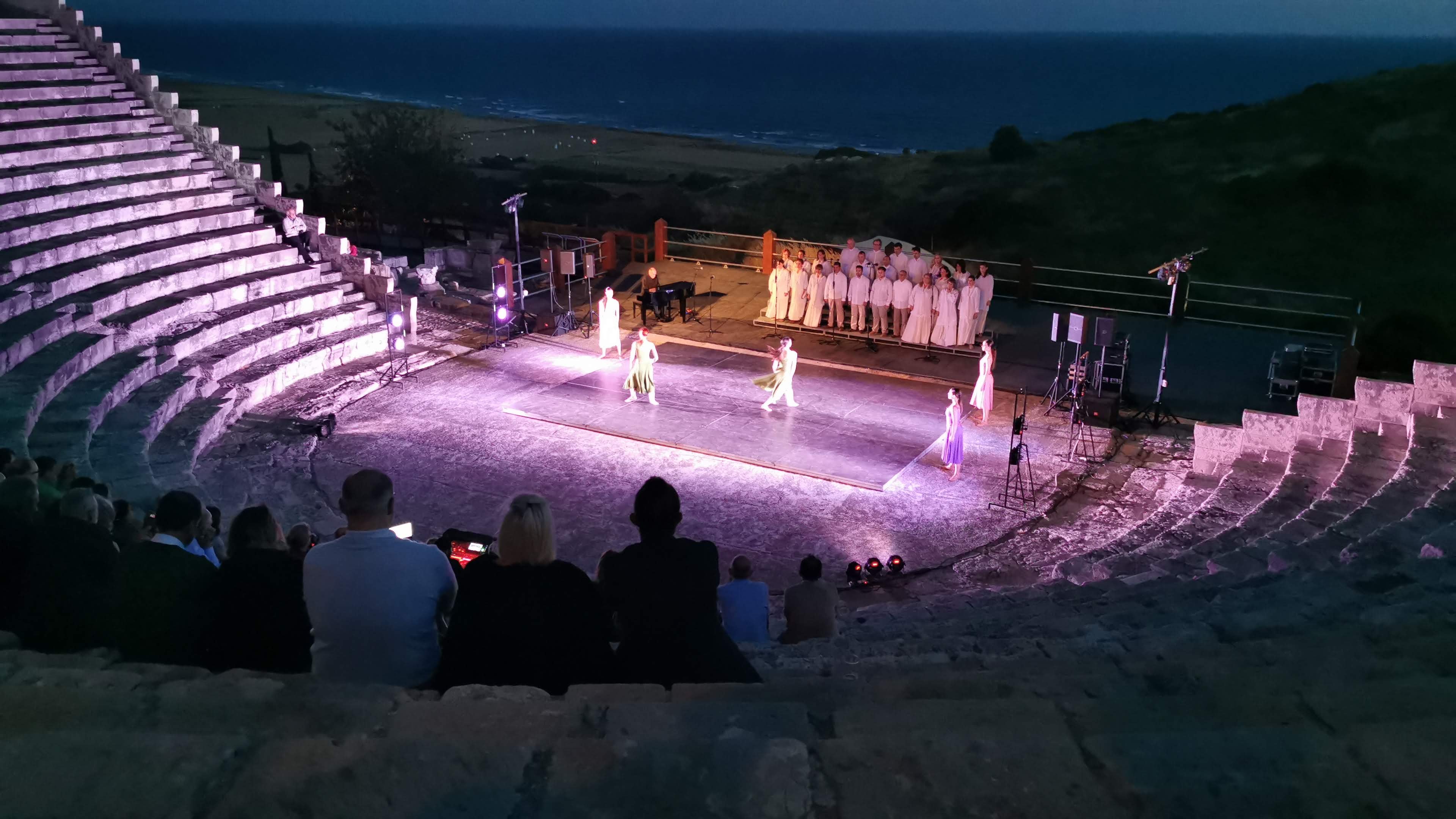 Performers in traditional dress at a themed corporate evening