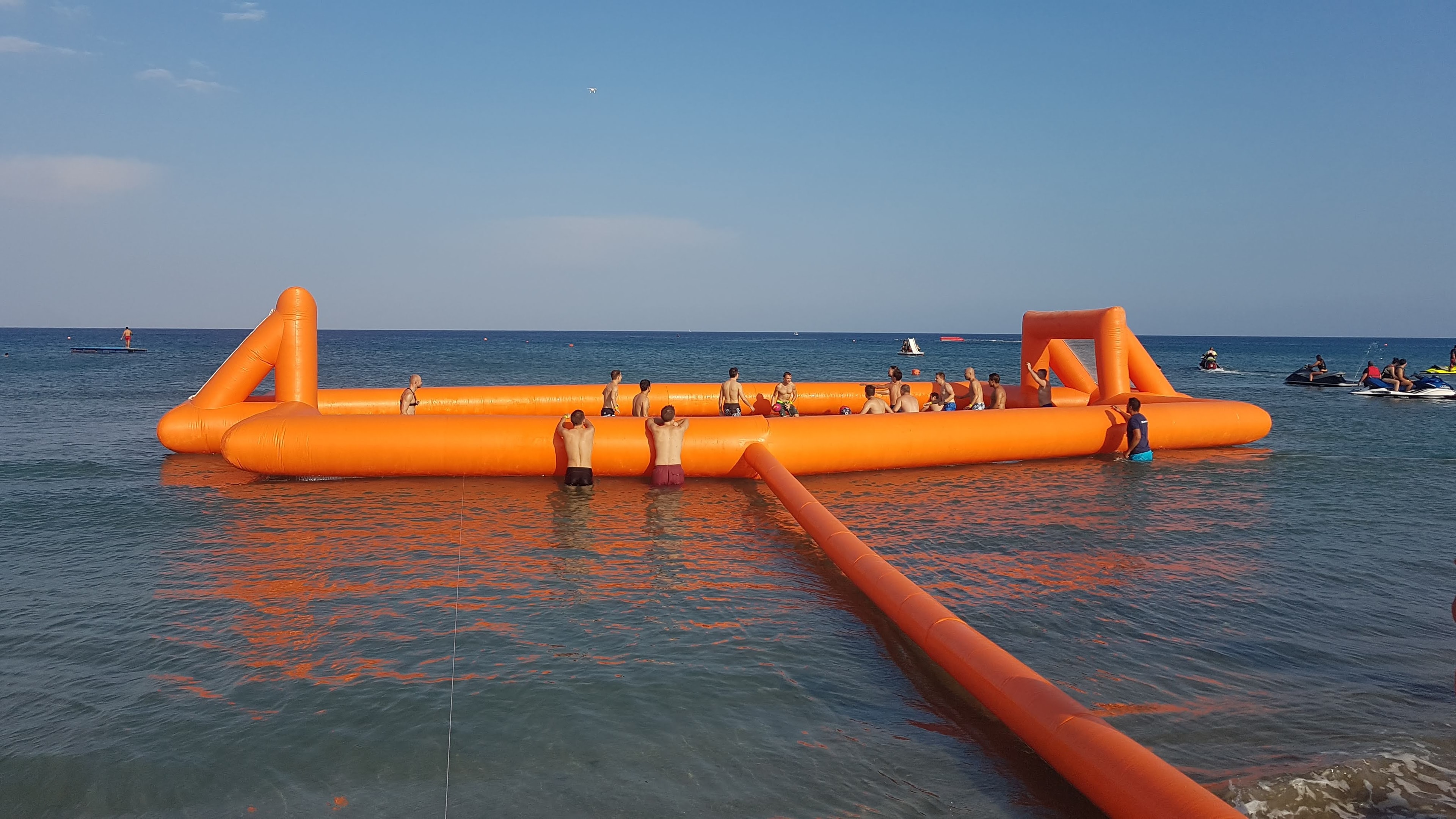 Colleagues collaborating during a beach team challenge