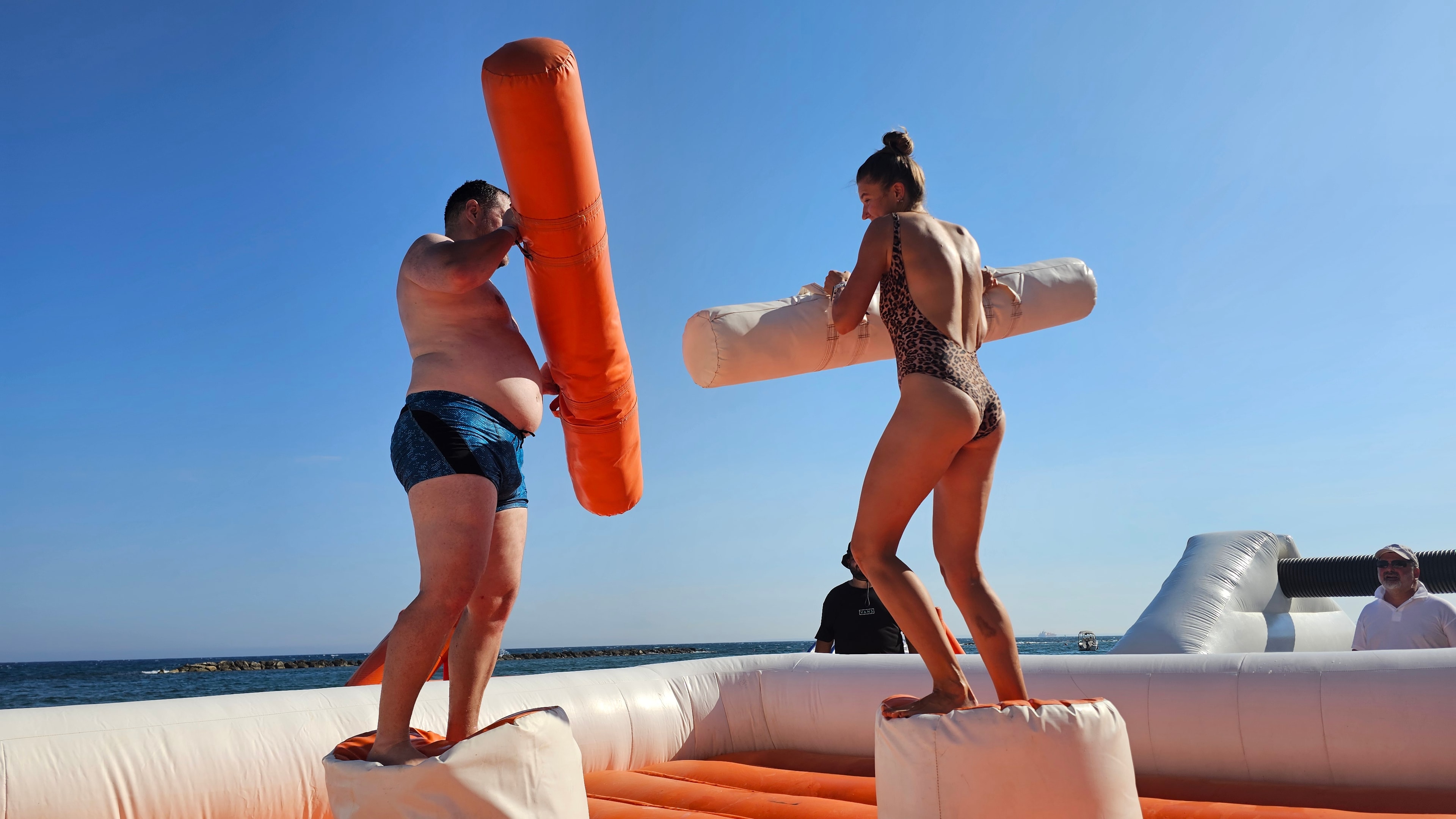 Teams enjoying a lively inflatable race activity
