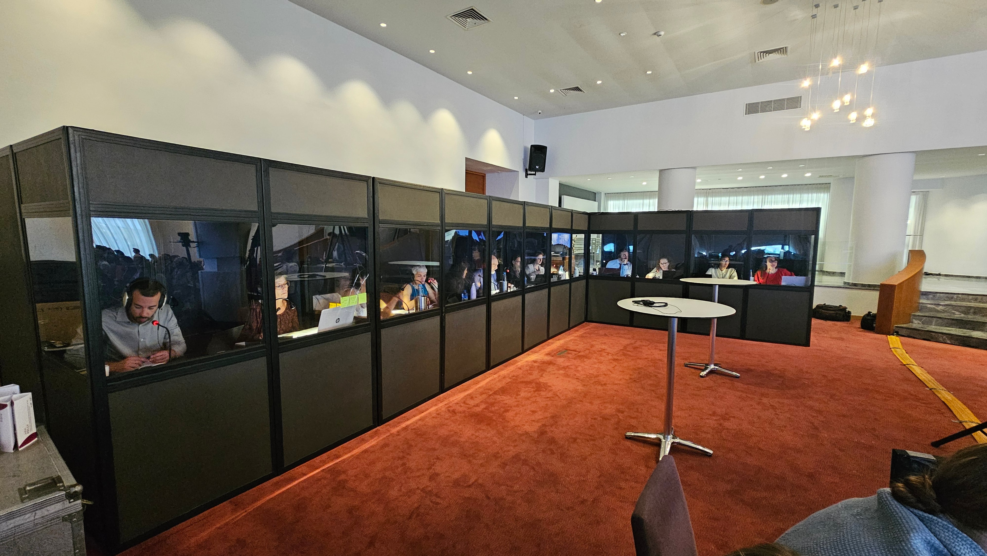 Interpretation team working from a dedicated booth at a conference