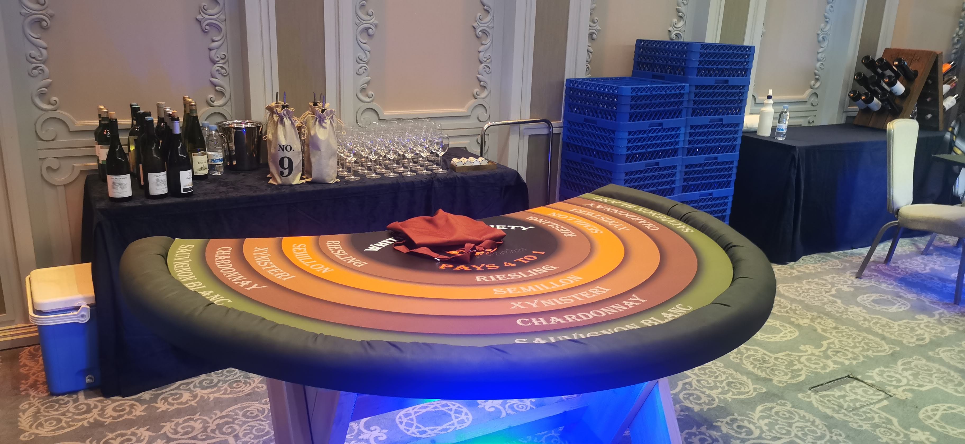 Wine Casino tasting wheel and curated bottles in an elegant event setting